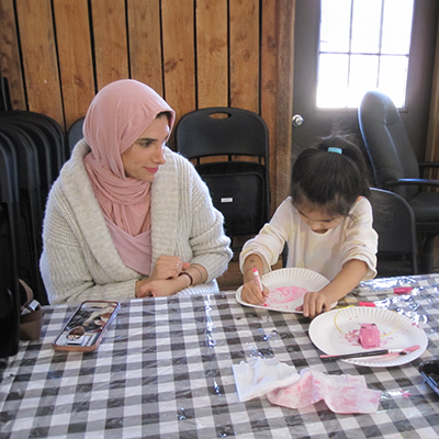 A woman and her daughter doing crafts