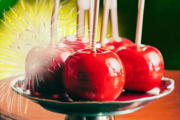 Digital illustration of a plate of candy apples.